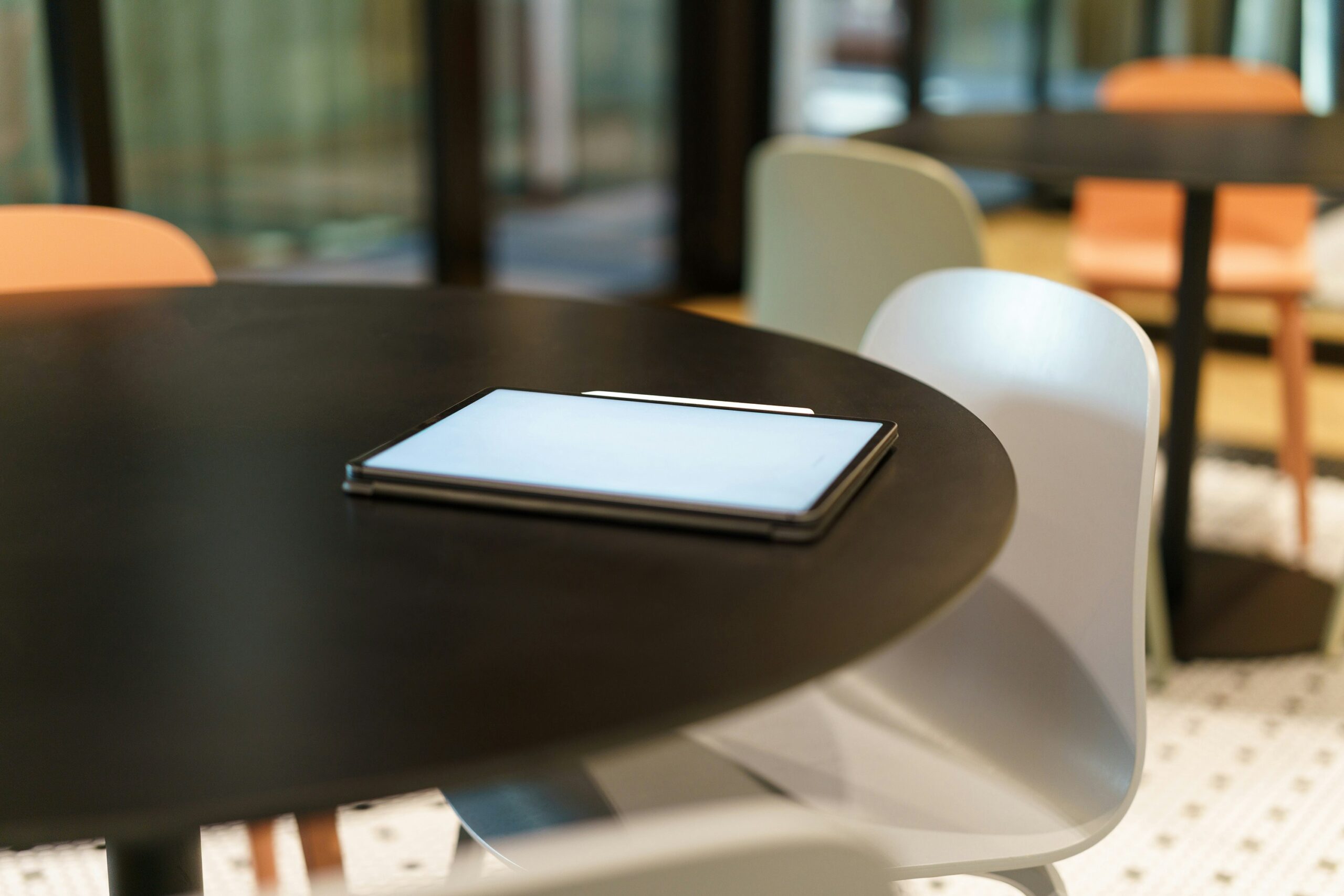 A cell phone sitting on top of a wooden table